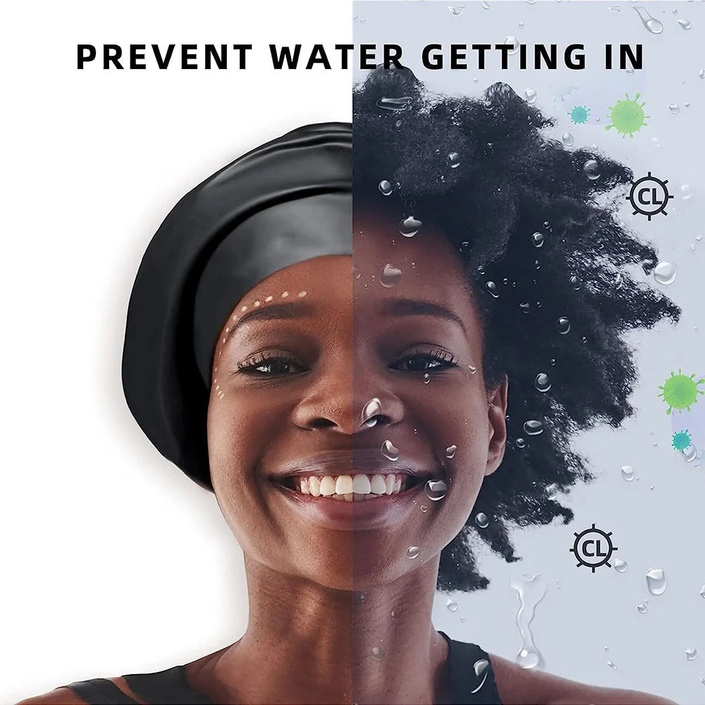 A close-up photo of a woman wearing a black silicone swimming cap, smiling, with water droplets visible on her face and hair.