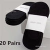 A pair of black invisible silicone no-show boat socks displayed on a white background.