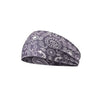 A dark gray patterned sports headband with paisley and geometric designs.