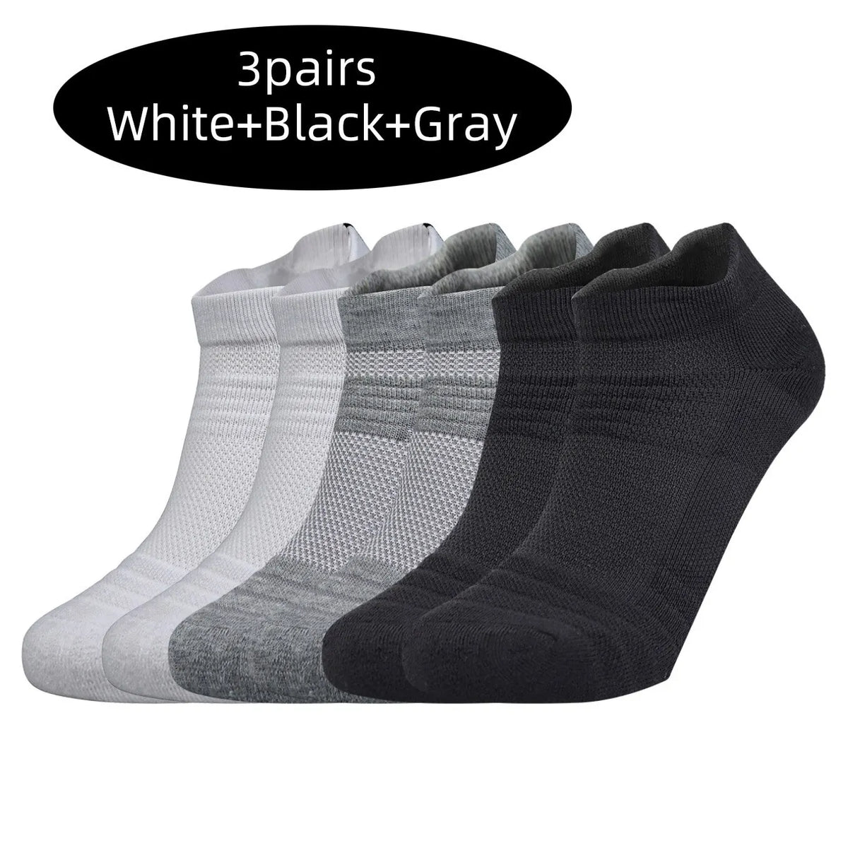 Three pairs of white, black, and gray performance running socks displayed side by side.