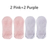 Four pairs of non-slip yoga socks in pink and purple colors