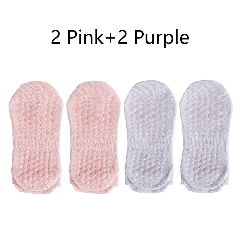 Four pairs of non-slip yoga socks in pink and purple colors