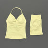A light yellow women's seamless backless fitness set top and bottom.