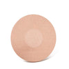 A round, light beige adhesive patch used for sensor fixing.