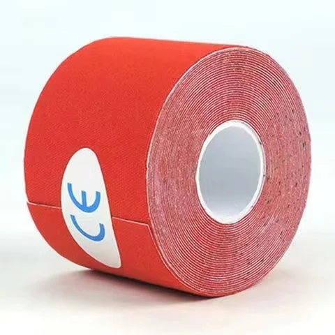 Roll of red kinesiology tape for athletic recovery