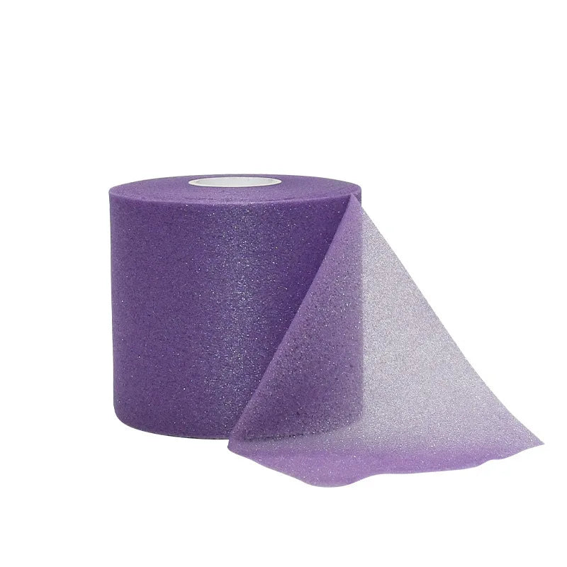Purple protective foam athletic tape wrap rolled on a spool and partially unwrapped