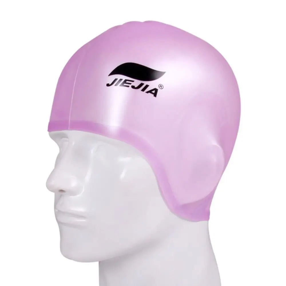 A pink universal silicone swimming cap displayed on a white mannequin head.