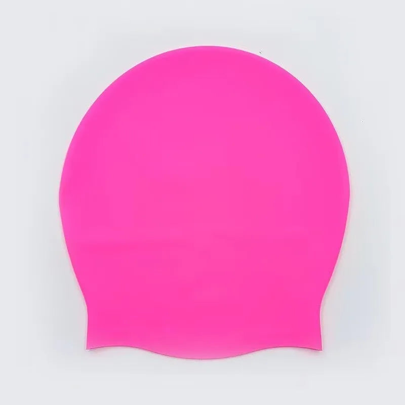 A bright pink extra large silicone swim cap designed for long hair.