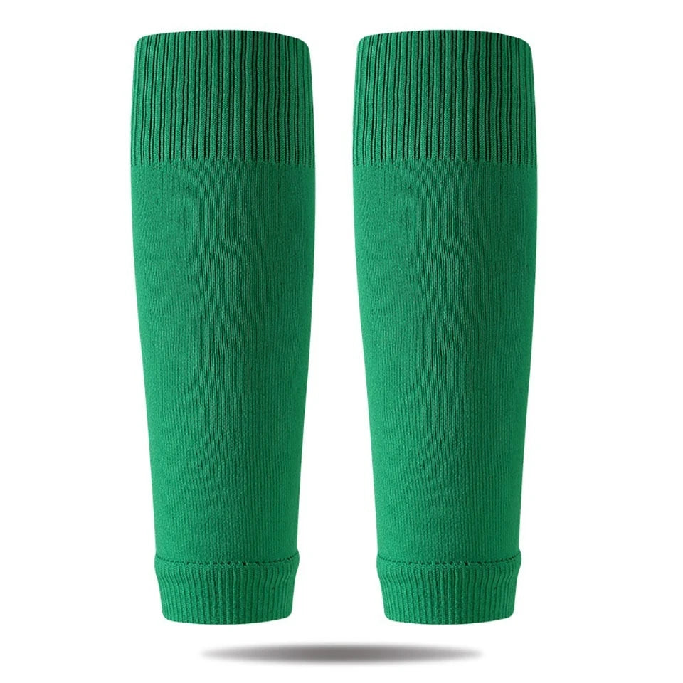A pair of green professional compression soccer and sports sleeves.