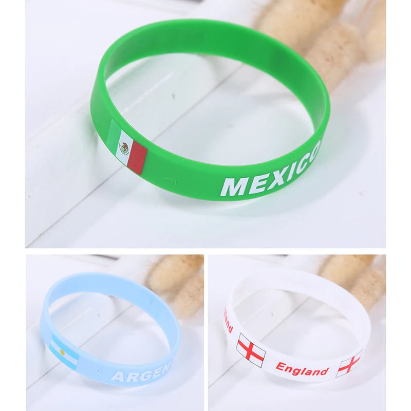 Three silicone wristbands in green, light blue, and white featuring national flags of Mexico, Argentina, and England.