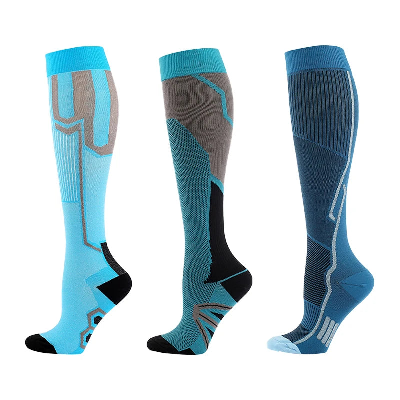 Three pairs of blue and gray compression socks for athletes and medical use shown from the side.