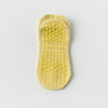 Paire de chaussettes de yoga et de fitness jaunes respirantes avec semelle texturée
