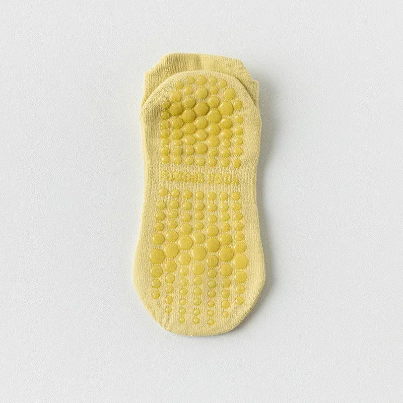 Paire de chaussettes de yoga et de fitness jaunes respirantes avec semelle texturée