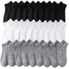 Stapel atmungsaktiver Polyester-Baumwoll-Strumpfhosen für Herren in Schwarz und Weiß.