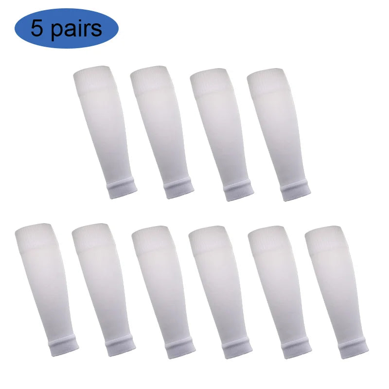 Five pairs of white football shin guards for leg protection