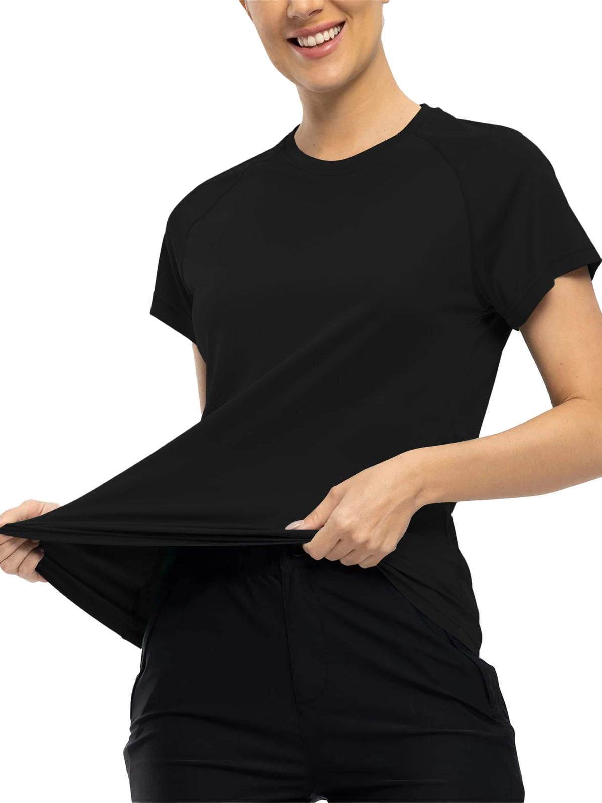 A woman wearing a black quick dry moisture-wicking gym t-shirt and black pants.