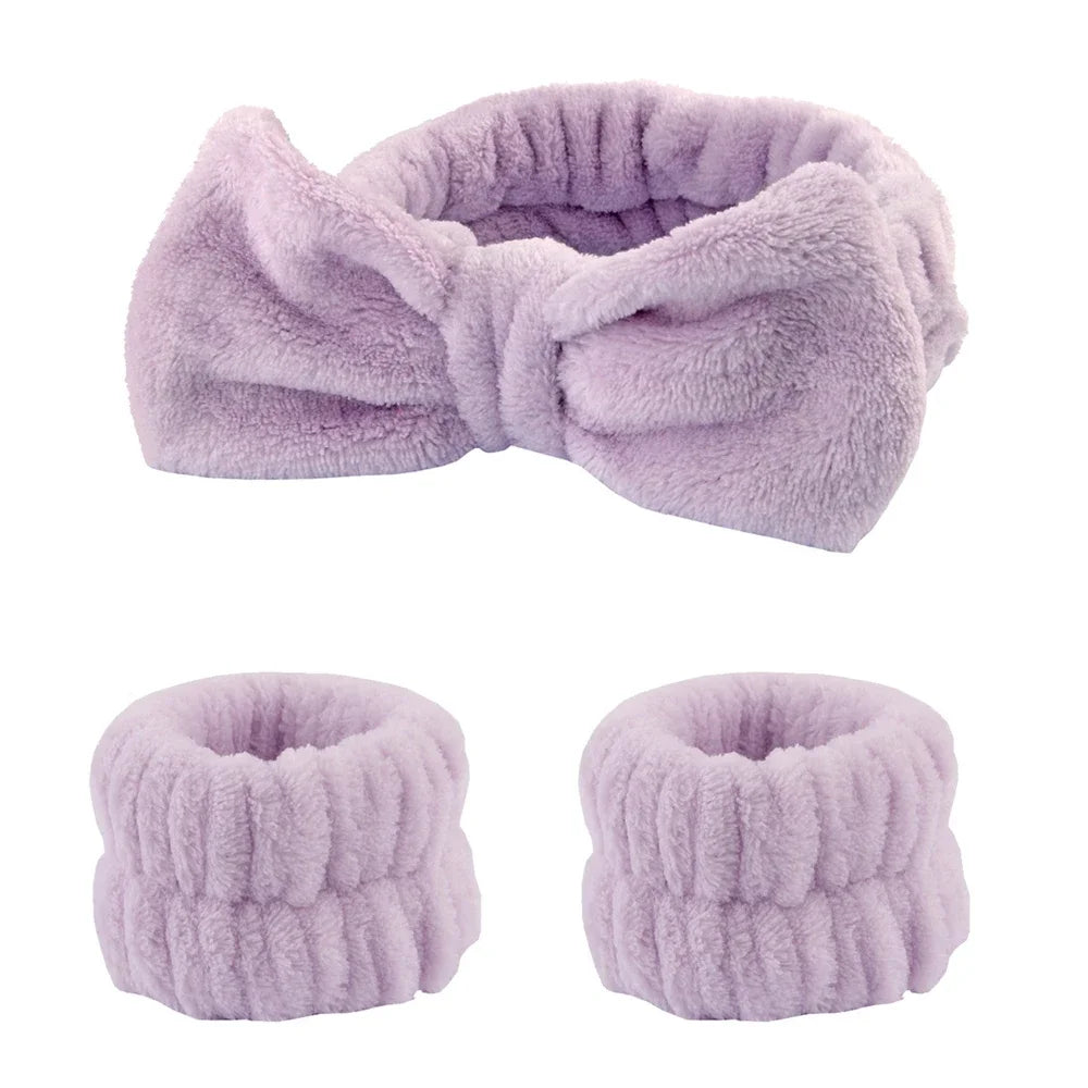 A set of lavender microfiber spa headband and wristband featuring a fluffy texture.