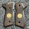 A pair of custom diamond pattern grips made of dark wood and textured material for a firearm.