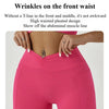 A model wearing bright pink high-waisted athletic leggings, showcasing the abdominal muscle line.