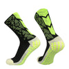 A pair of neon yellow and black anti-slip training socks shown from the side.