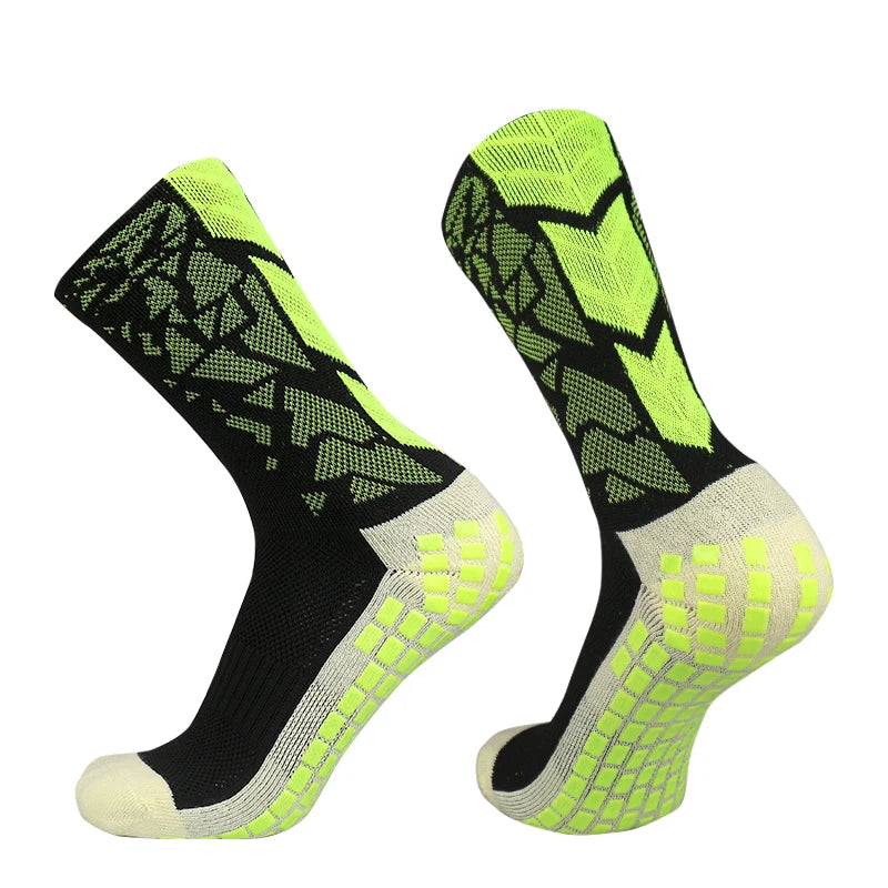 A pair of neon yellow and black anti-slip training socks shown from the side.
