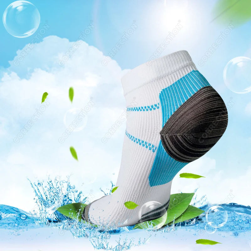 White and blue compression socks shown against a bright blue background with water splashes and green leaves.