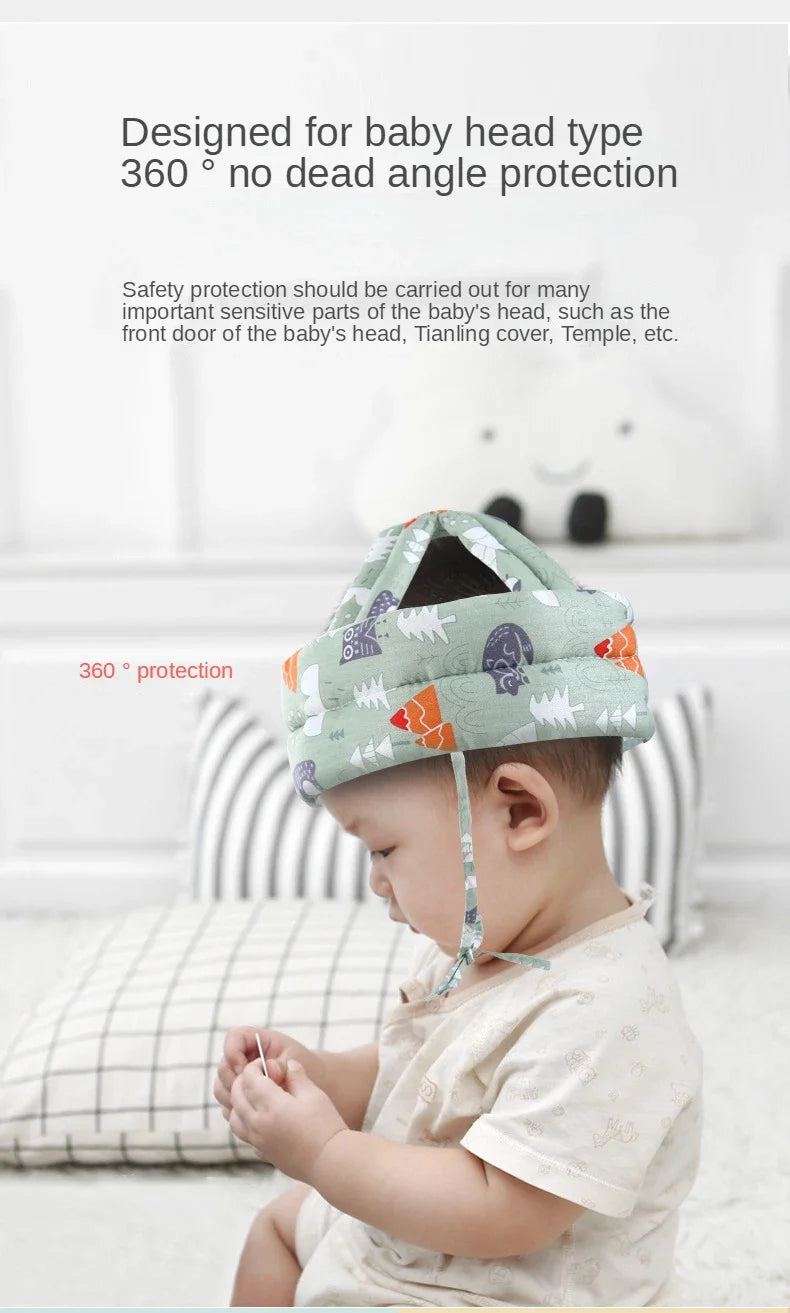 A baby is wearing a soft adjustable safety helmet designed for baby head protection.