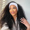 A woman with long black curly hair is wearing a white bow headband.