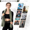 A woman models a green microfiber quick-dry beach towel suitable for various outdoor activities.