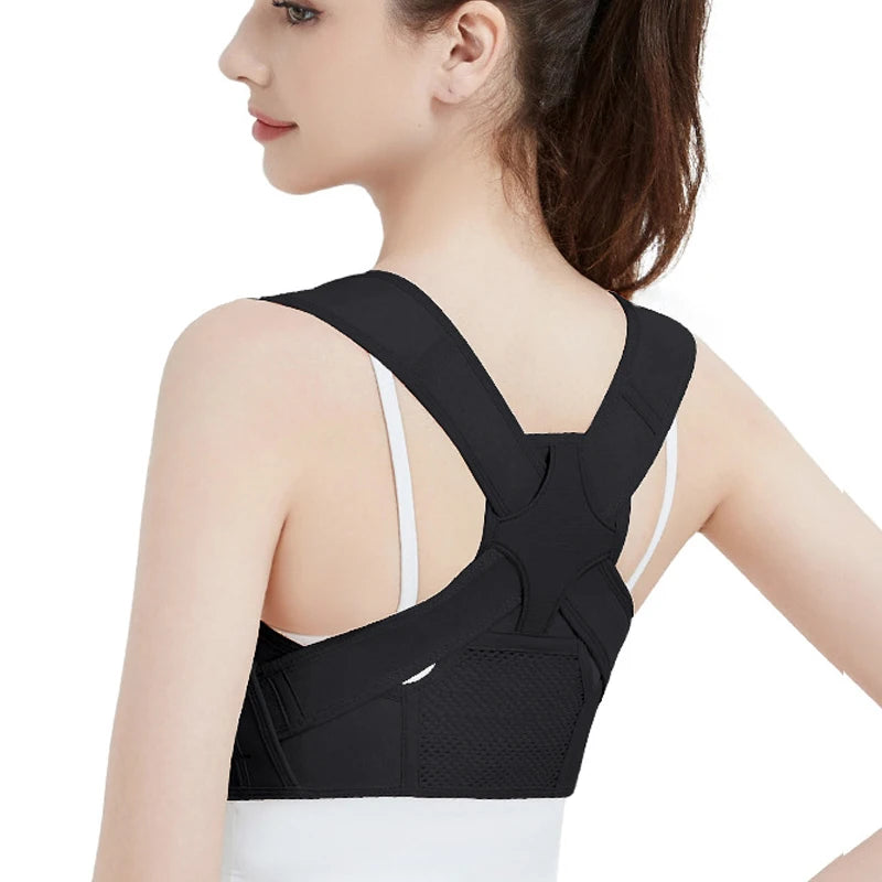 A woman wearing a black adjustable posture corrector for back and shoulder support.