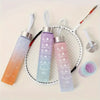 A set of clear and purple leakproof sports water bottles with straws displayed on a white mesh plate.
