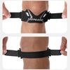 Black knee strap device worn on the lower leg for pain relief and stabilization.