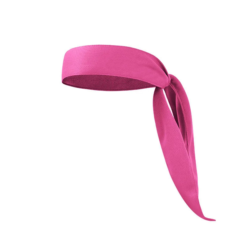 Una cinta deportiva rosa brillante ajustable enrollada en una banda de tela.