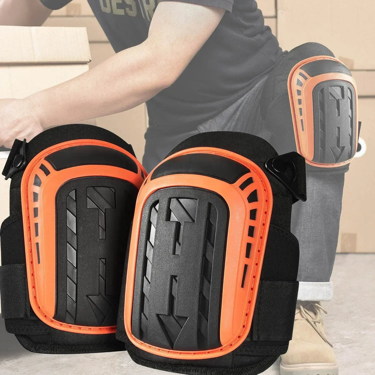 A person wearing black and orange heavy duty gel knee pads on their legs.