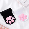 Pink cat paw pads are displayed on a black and white thigh high sock for cosplay.