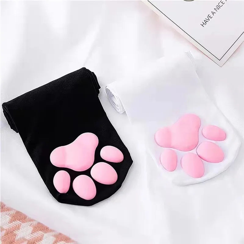 Pink cat paw pads are displayed on a black and white thigh high sock for cosplay.