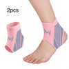 Two pink compression ankle support foot sleeves shown on a person's ankle.