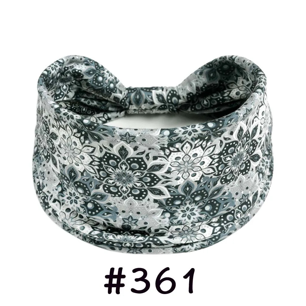 A patterned grey and white boho knotted cotton headband for yoga or workout.