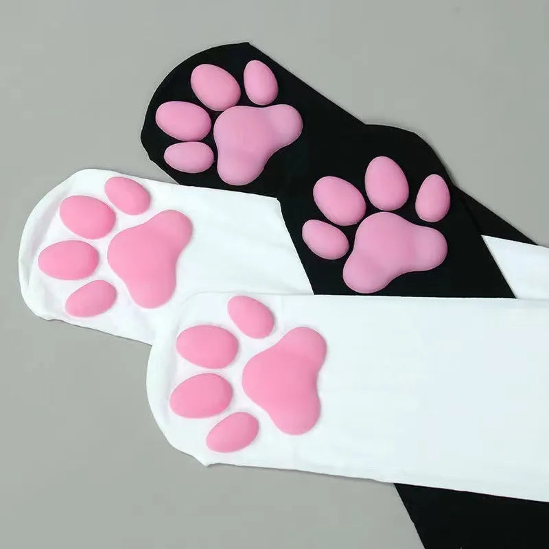Black thigh high socks with pink cat paw print patterns.