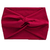 A deep red women's elastic sports headband tied in a knot.