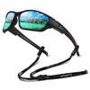 Black sunglasses with a scenic tropical view of colorful buildings and blue water.