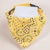 A yellow patterned bandana with a white tag is displayed against a light background.