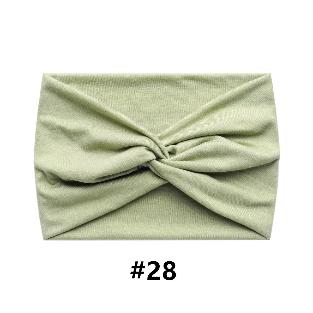 A light sage green fabric headband tied in a knot, shown flat.