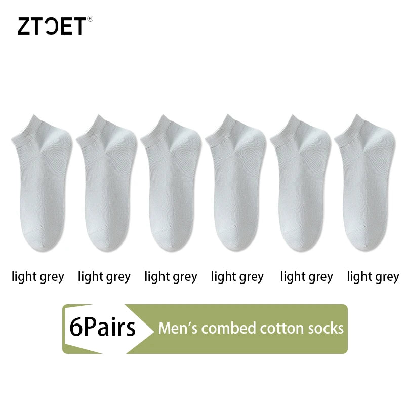 Six pairs of light grey men's combed cotton socks displayed side by side.