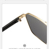 Close-up of gold-rimmed sunglasses with a black frame and dark lenses showing a smooth and durable hinge.