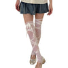Person in light top and denim skirt with sheer white tie-up thigh-high leg warmers and silver heels.