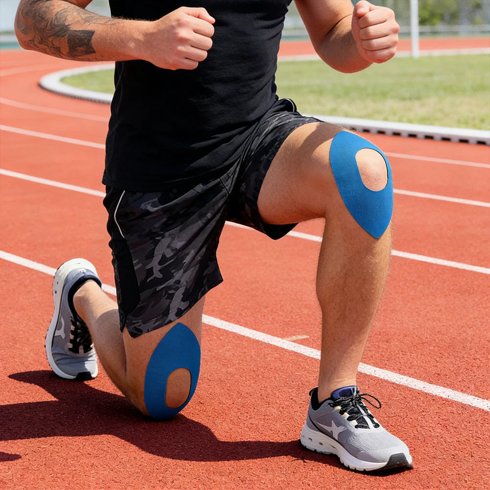 Person running on a track wearing blue kinesiology tape on knee and calf.