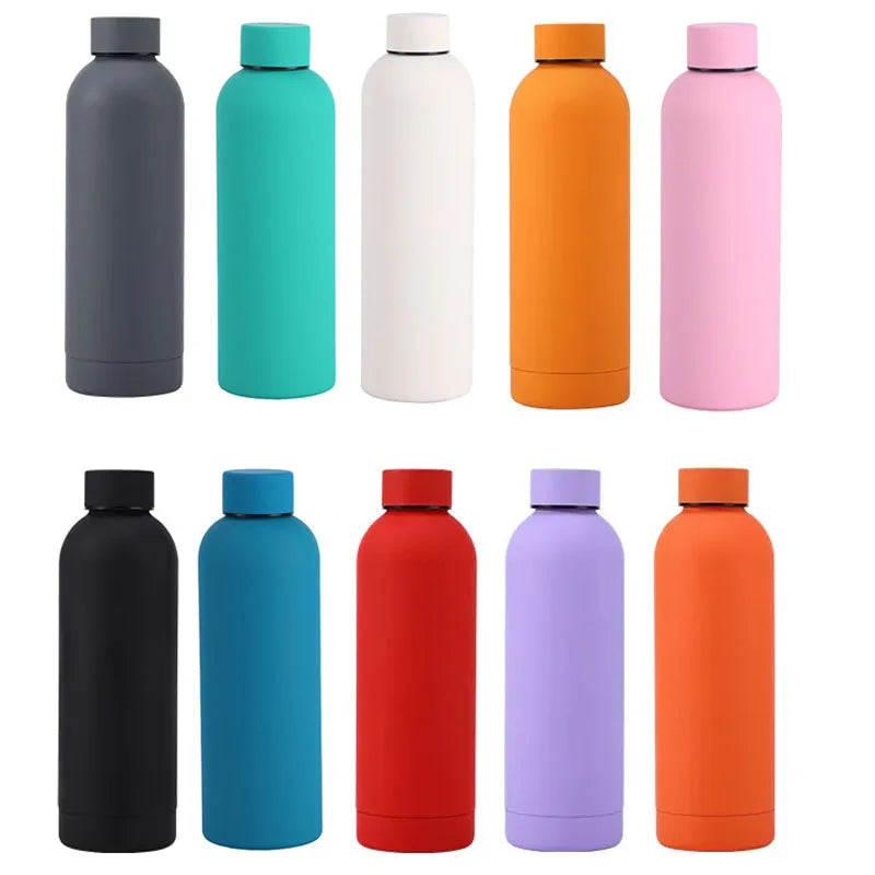 A row of nine insulated stainless steel thermos cups in various shades of gray, teal, white, orange, and pink.