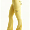 A model wears high-waisted yellow flared fitness pants with multiple pockets and gray athletic shoes.
