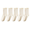 A pack of three white cotton ankle socks with ruffled edges.